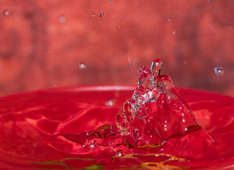 Water Splash photography with red background