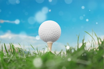 Golf ball on tee on golf course