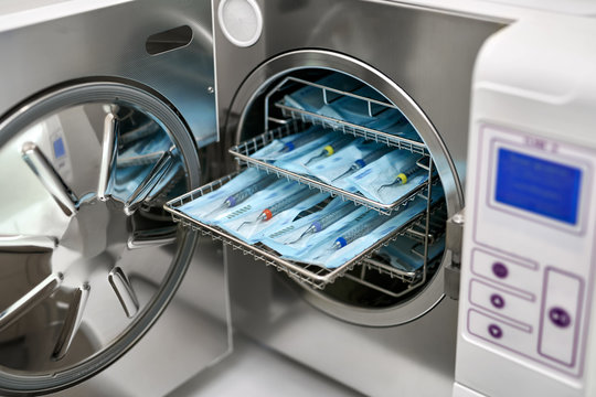 Sterilize machine with opened door and dental probes inside