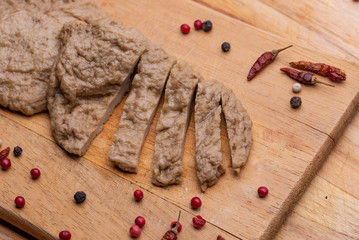 Fake meat. Meat analogue (also called  alternative, substitute, mock, faux, imitation, vegetarian, vegan) meat. Wheat gluten, also called seitan, mianjin, milgogi, gluten meat.