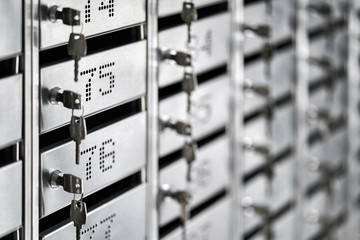 Numbered metal mailboxes with keys in them
