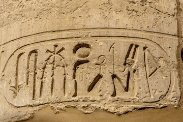 Egyptian ancient hieroglyphs on the stone wall