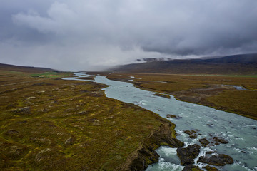 Views of Skjalfandafljot river. It has its source at the northwestern border of the icecap Vatnajokull on the Highlands of Iceland. Aerial drone shot. September 2019