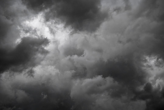 Dark sky and dramatic black cloud before rain.A tropical cyclone is a rapidly rotating storm system characterized by a low-pressure center, a closed low-level atmospheric circulation, strong winds.
