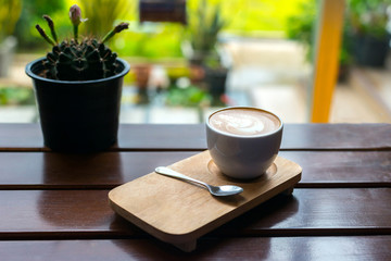 coffee cup latte art on blurred  background.