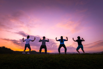 Group of healthy girl show hands with  sunset background.Healthy exercise lifestyle concept.