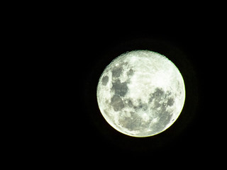 Obraz premium Moon in the middle of its way on the clear sky.