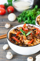 Wheat noodles udon with mushrooms and vegetables in Tereyaki sauce