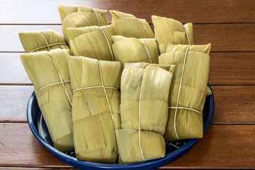 Pamonha. Brazilian Corn Snack on wooden background in Brazil