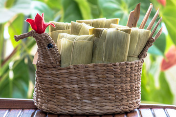 Pamonha. Brazilian Corn Snack on chicken basket