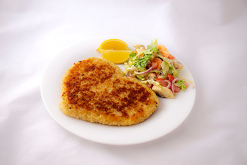 Heart shape Chicken Schnitzel with salad