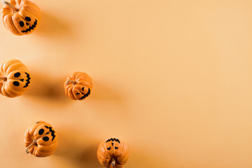 Top view of Halloween crafts, orange pumpkin on orange background with copy space for text. halloween concept.