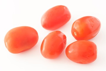 Cherry tomatoes isolated against white