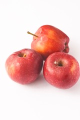 Red apples isolated against white