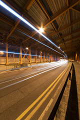 light trails and head lights of traffic in tunnel. Transportation background