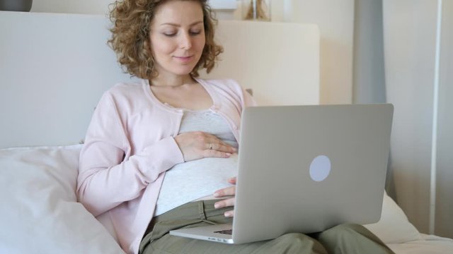 Pregnancy, Technology, People And Leisure Concept. Pregnant Woman With Laptop.