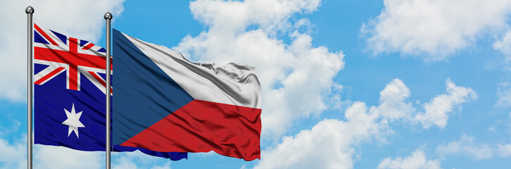 Fototapeta na wymiar Australia and Czech Republic flag waving in the wind against white cloudy blue sky together. Diplomacy concept, international relations.