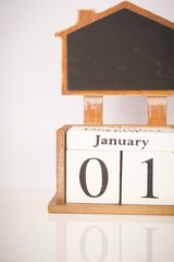 Happy New Year concept. 2020 wordings with wooden block calender showing 1st January isolated against white