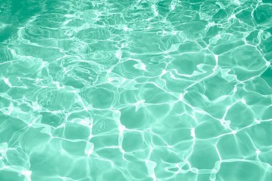 Surface of green swimming pool texture background, Beautiful water in swimming pool.