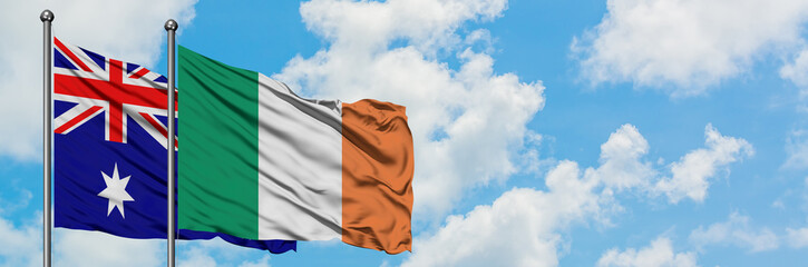 Australia and Ireland flag waving in the wind against white cloudy blue sky together. Diplomacy concept, international relations.