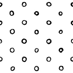 Hand drawn circles or rings seamless pattern in black and white. Perfect for wrapping paper, textile, fabric and backdrops. Vector polka dot pattern.