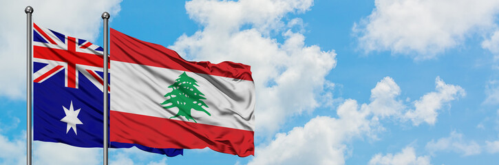Australia and Lebanon flag waving in the wind against white cloudy blue sky together. Diplomacy concept, international relations.