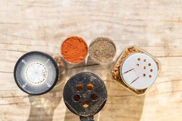 Spice jars with different lids for sprinkling food top view