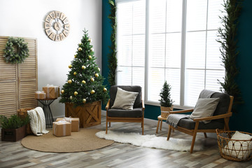Beautiful interior with decorated Christmas tree in living room