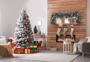 Beautiful interior of living room with decorated Christmas tree