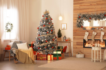 Beautiful interior of living room with decorated Christmas tree