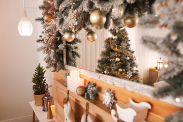 Wooden decorated mantelpiece at home. Christmas interior