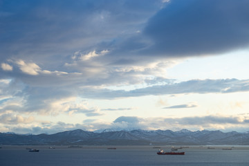 Marine landscape with views of the Avacha Bay with the ships.