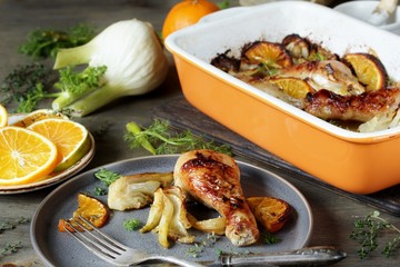 dish with fennel. Baked chicken drumsticks with fennel and oranges. festive dish, popular in the Mediterranean. Keto diet dish. ceramic baking dish.