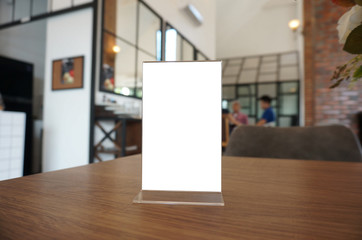 Menu frame standing on wood table in Bar restaurant cafe. space for text marketing promotion.