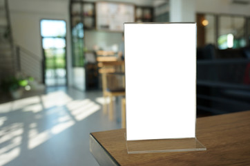 Menu frame standing on wood table in Bar restaurant cafe. space for text marketing promotion.