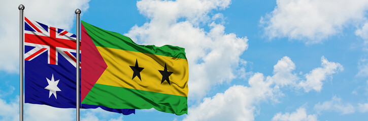 Australia and Sao Tome And Principe flag waving in the wind against white cloudy blue sky together. Diplomacy concept, international relations.