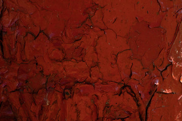 Old bloody red cracked paint.Abstract texture.Creepy background.Urban design.Naturally broken.Aged paint.