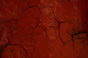 Old bloody red cracked paint.Abstract texture.Creepy background.Urban design.Naturally broken.Aged paint.