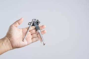 Hand holding kitchen classic can opener