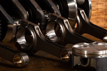 motorcycle engine parts on a workbench with some tools