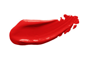 Red lipstick smear smudge swatch isolated on white background. Creamy make up texture. Bright  color cosmetic product brushstroke swipe sample