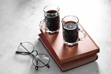 Coffee in cup and books on rustic table with a blank space for a text, Espresso in cup on white background