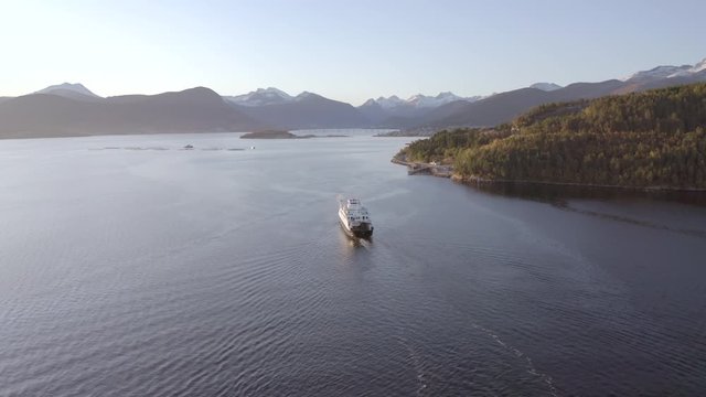 Norwegian Ferry Service Crossing a Fjord Carrying Passengers and Vehicles