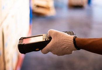 barcode scanner staff wearing white gloves. Barcode reader.	