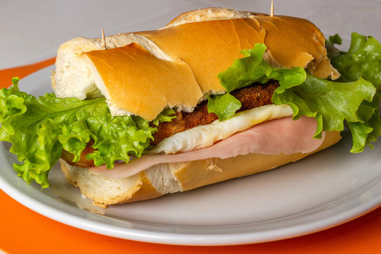 Sandwich de milanesa completo Stock Photo | Adobe Stock