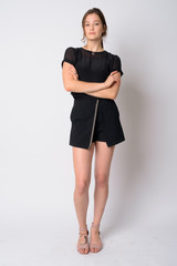 Fototapeta premium Full body shot of young beautiful woman with arms crossed