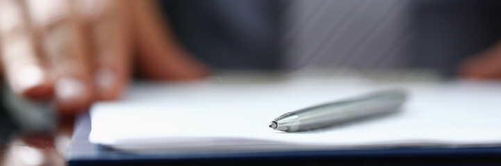 Male arm in suit offer contract form on