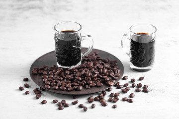 Coffee in cup and coffee beans on rustic table with a blank space for a text, Espresso in cup on white background