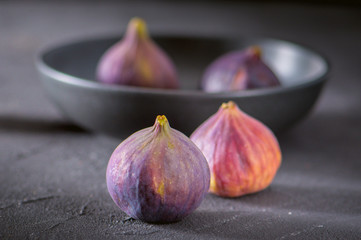 Close up view of fresh figs on dark background