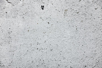 Texture of a concrete wall with cracks and scratches which can be used as a background